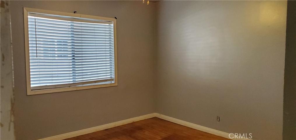 Front Bedroom also has ceiling fan and hardwood floor