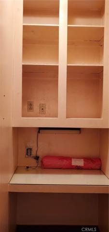 Tiny Office with pocket door. Located between family room and Primary Suite. Could be an extra closet ;)