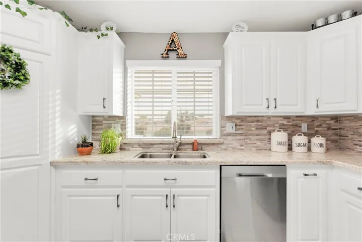 Custom inserts with pots and pans pull outs, cookie sheet and large pan storage.