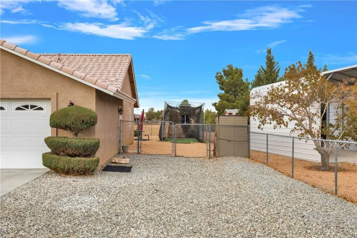 Easy drive through access to main back yard and side yard.