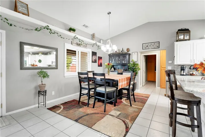 Large dining room has plenty of space for a grand dining suite. Note it currently hosts the hutch and seating for six with plenty of room to spare.
