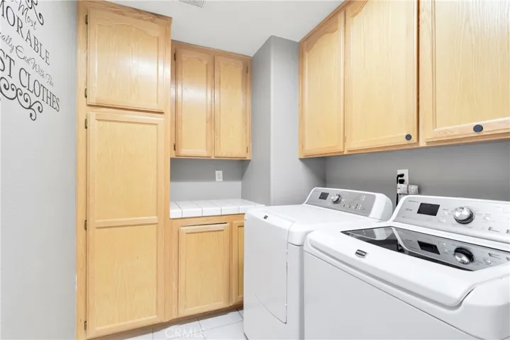 Large laundry room with custom cabinetry.