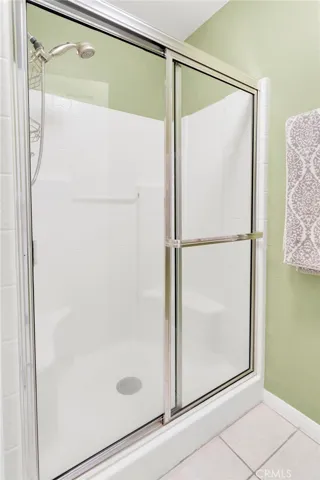 Primary bedroom suite with this double stall shower.