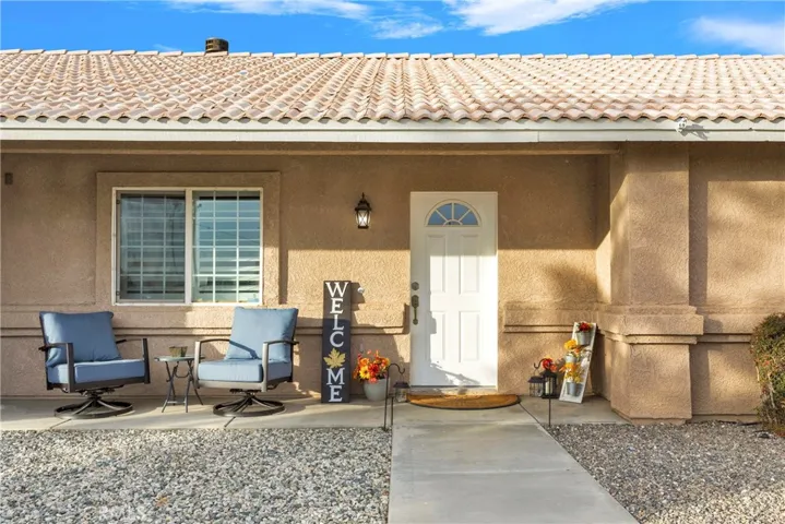 Welcoming front porch. The entire front yard is designed for easy care while capturing beautiful curb appeal.