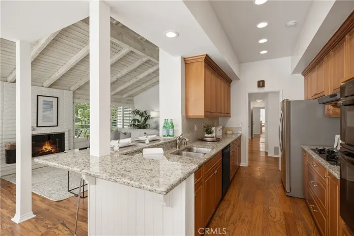 A gas cooktop, gas oven, microwave plus a newer garbage disposal in the kitchen.