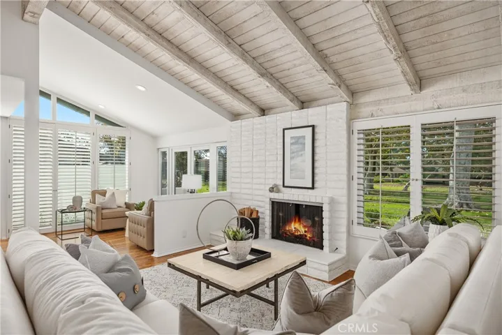 The spacious great room is cozy with a gas fireplace and plenty of seating for family gatherings.
