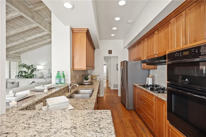 The kitchen is appointed with quality maple cabinets.