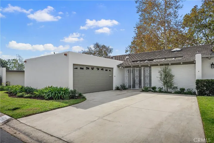 The property is a very private end unit with one common wall and a double-gated side yard.