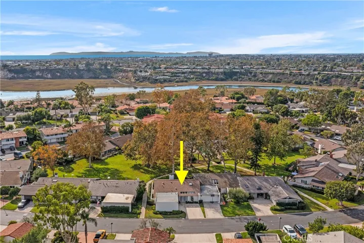A central and coveted location on a long and wide grassy, scenic greenbelt with many walkways.