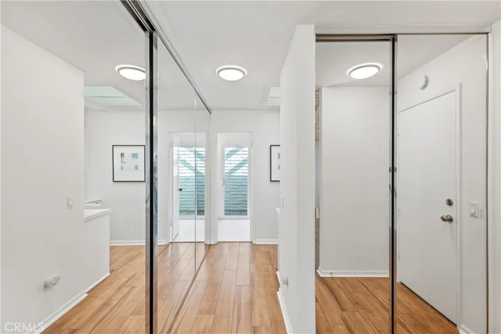 Master bedroom, ample closet space and mirrored doors.