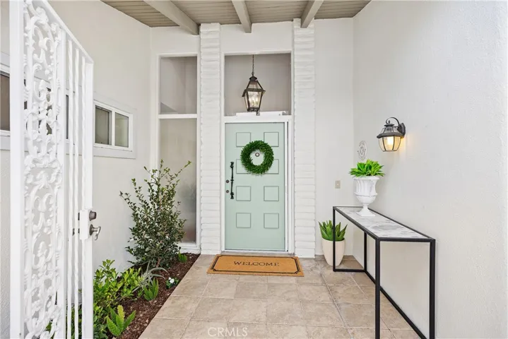 A glass chandelier at the front door area greets you as you enter.