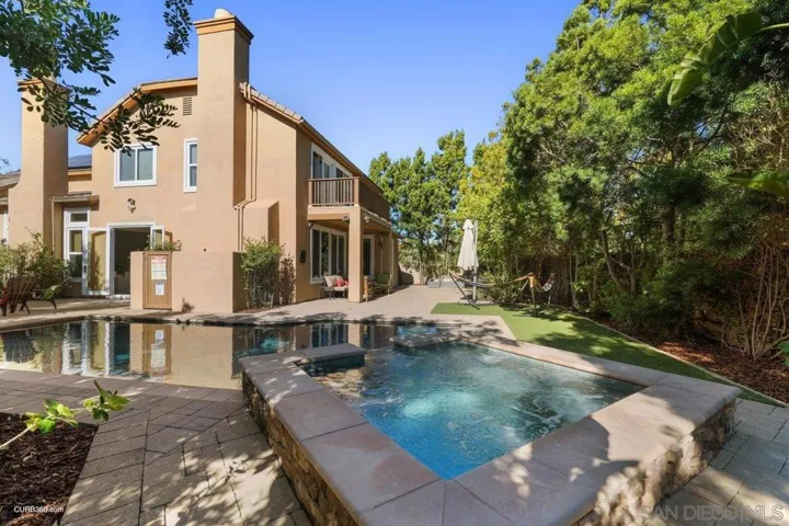 Rear Yard from sitting area behind pool