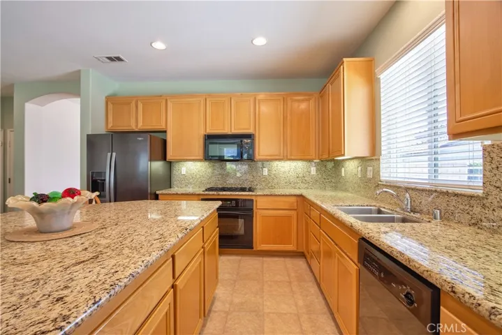 Granite Counters & Backsplash, Maple Cabinetry