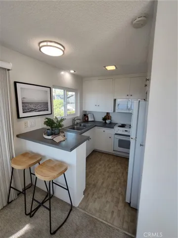 Kitchen with ocean view above sink