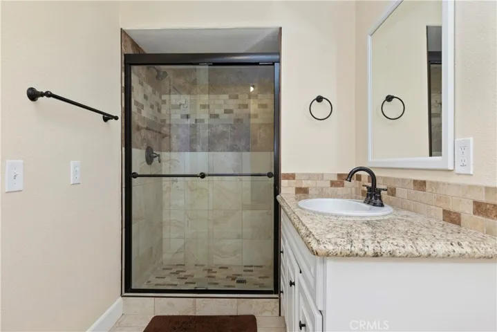 GUEST QUARTERS BATHROOM WITH WALK IN SHOWER