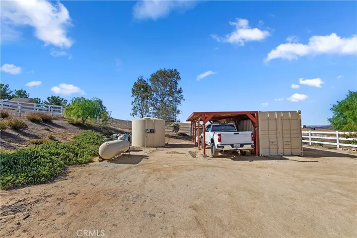 SIDE YARD RV PARKING, 40' POD, CARPORT.