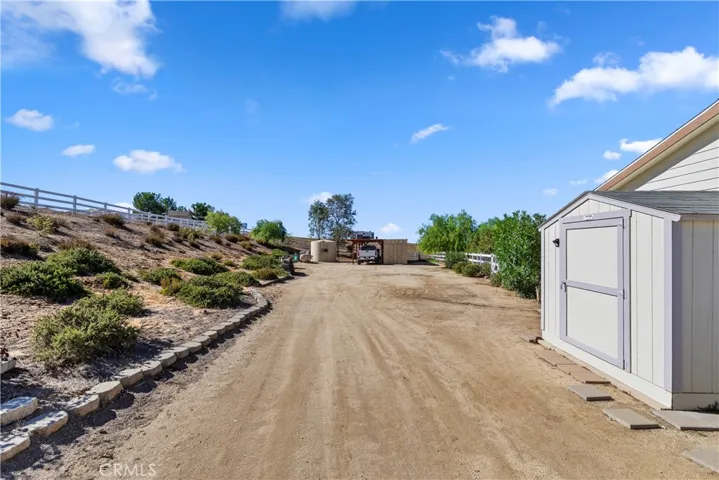 SIDE YARD TO RV PARKING. SHED