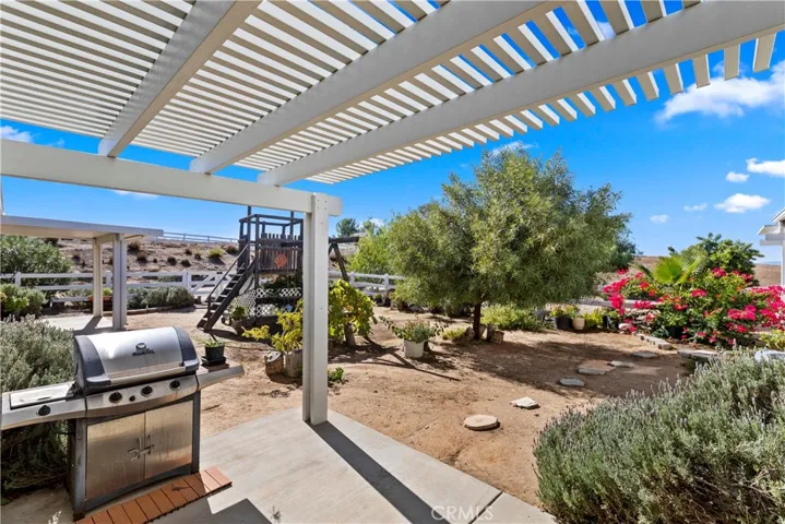 BACK PATIO IN ENCLOSED/FENCED YARD