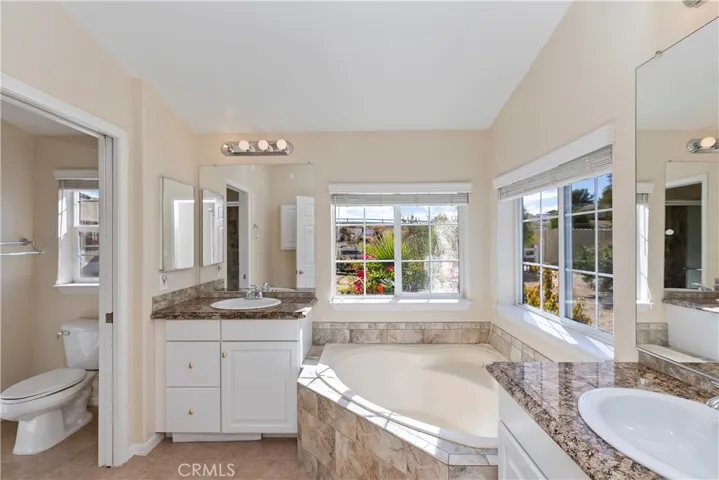 MAIN HOUSE PRIMARY BATHROOM-HAS WALK IN SHOWER & SOAKING TUB