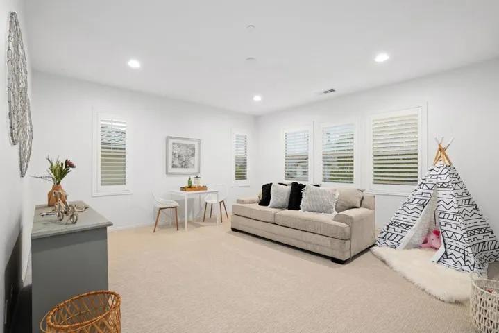 Spacious upstairs bonus room can be used as a family room, game room or bedroom