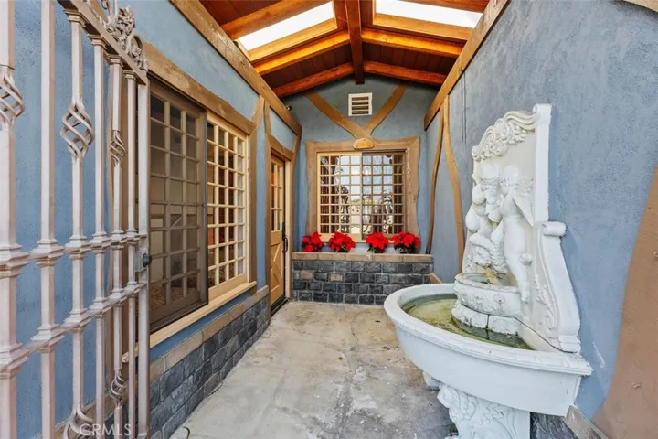 Secure gated entry with fountain for privacy and tranquility.