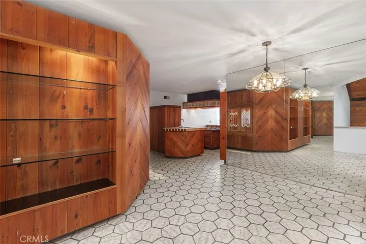 Plenty of woodwork for display, dining area and an open kitchen with direct garage access around the corner,