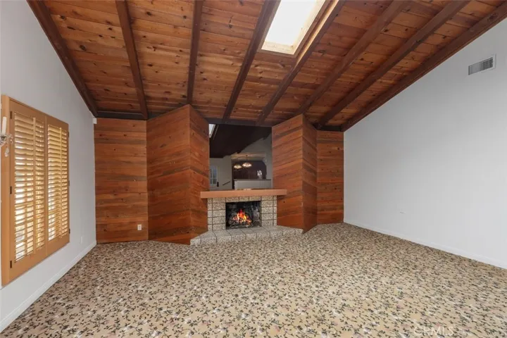 a warming smoked mirror over the fireplace not to be missed.