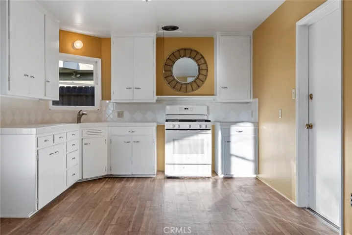 Kitchen with door to garage at right