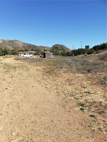flat area below the street and before the hill