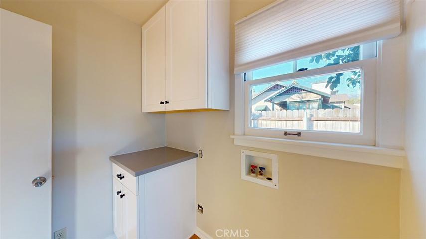 Laundry Room / Service Porch- Leads to Kitchen, backyard and basement