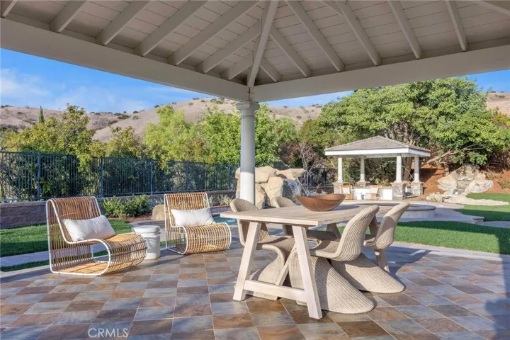 Covered gazebo off the kitchen makes for a great spot for al fresco dining!