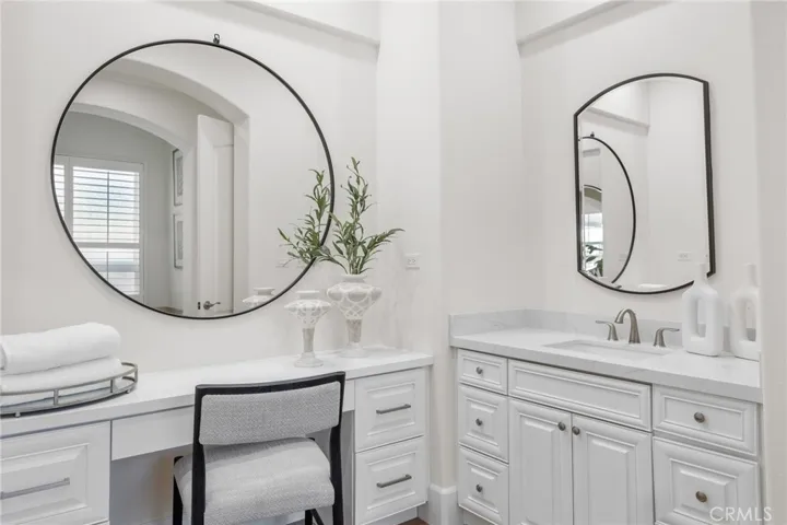 Primary bath features dual sink vanities plus a sit down makeup area