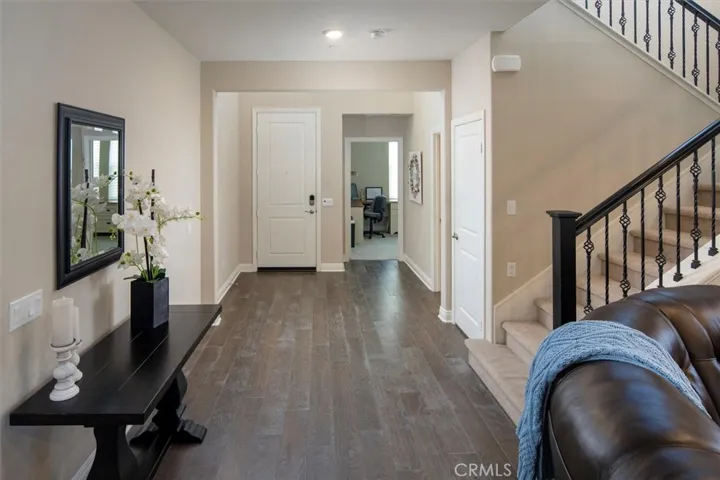 Beautiful entry with high ceilings Upgraded banister and flooring