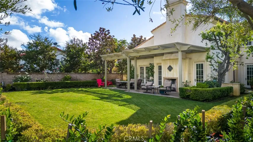 Large back yard with wood burning fireplace.