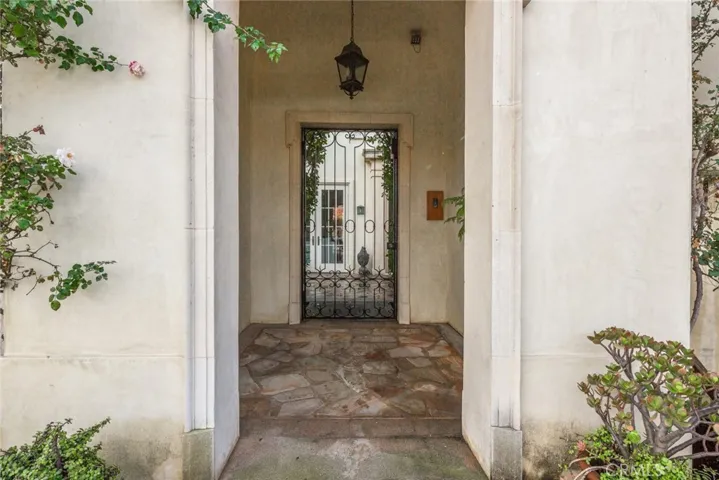 Entrance pavilion has wrought iron gate controlled by owner.