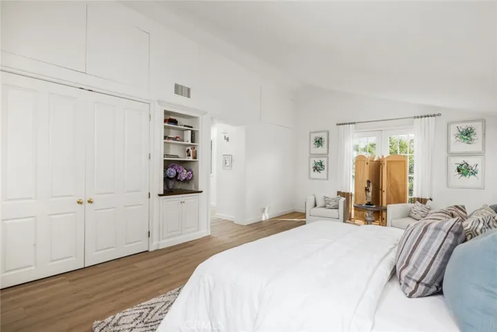 Just under ceiling beam are enclosed storage spaces.