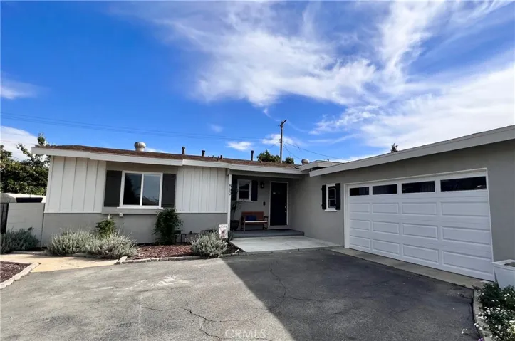 Front of the home showing two car garage with garage door opener