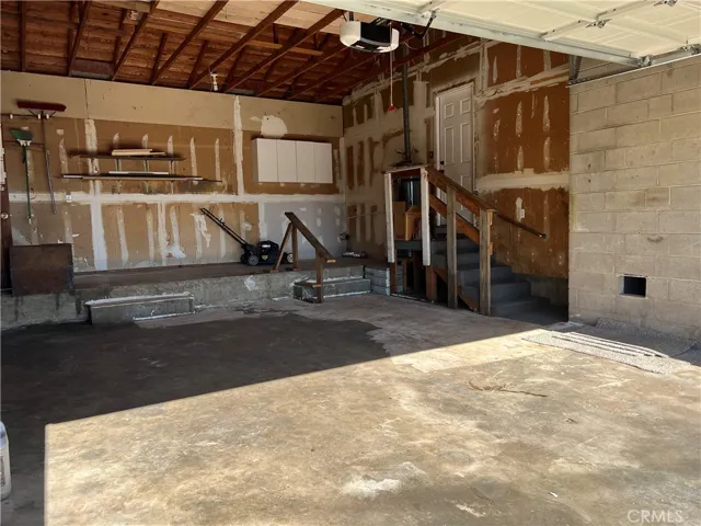 Huge 2 car garage with opener, access to backyard and an abundance of storage
