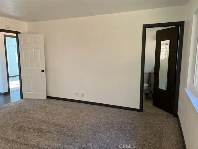 primary bedroom with bathroom