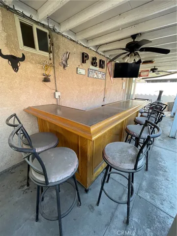 Outdoor custome built-in bar provides gatherings for friends and family! The outdoor television stays!