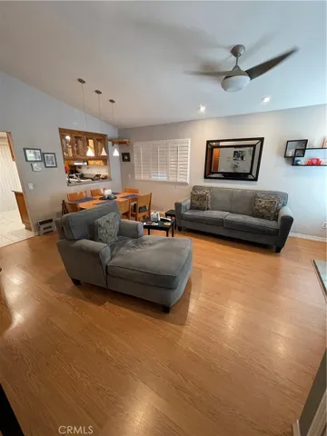 Recessed lighting adorns the living area, as do the vinyl 3 inch shutters.