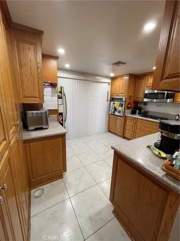Kitchen is equipped with lots of countertop space, Corian tile.