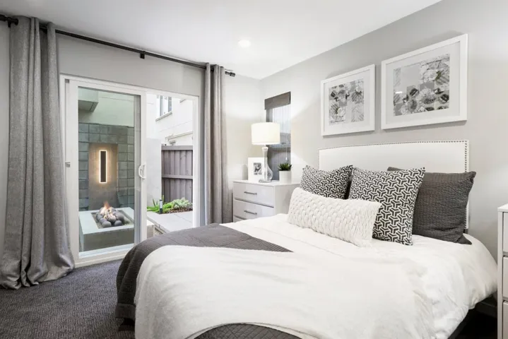 Located on the first floor with a sliding door to the patio.  There is a bathroom across the hallway.