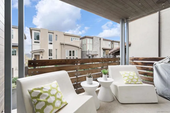Covered patio with area to grill.  The sliding doors fully open.