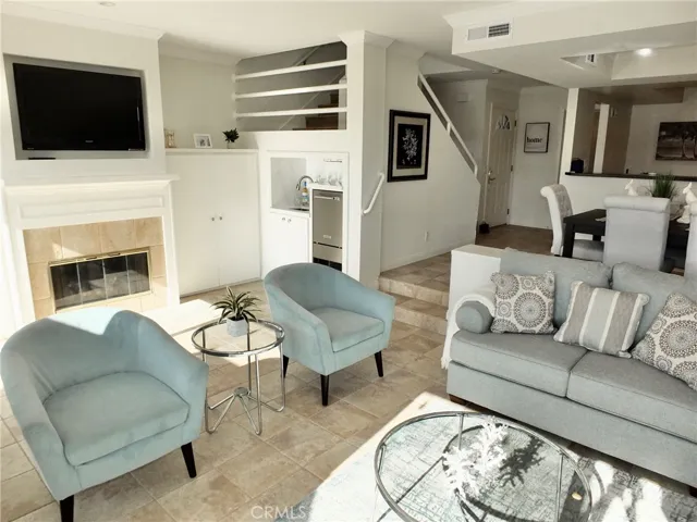 Living room with view to open stairwell & entry