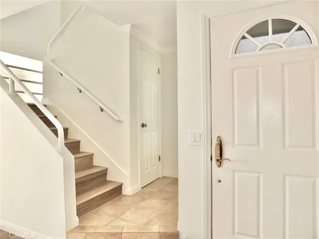 Entry & extra large closet under stairwell with access to wet bar