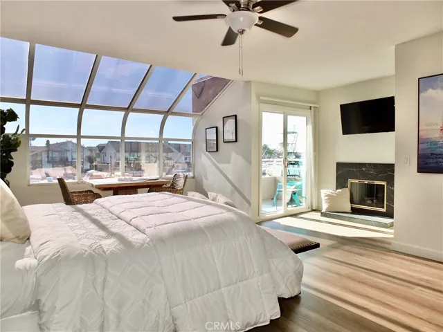 Primary bedroom has balcony & fireplace with gas logs