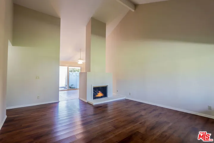 Living Room with Vaulted Ceiling and Fireplace