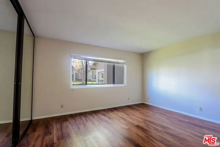 Primary Bedroom with Laminate Floors