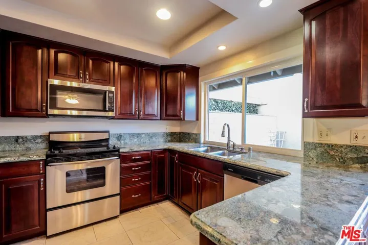 Kitchen with view of Enclosed Patio